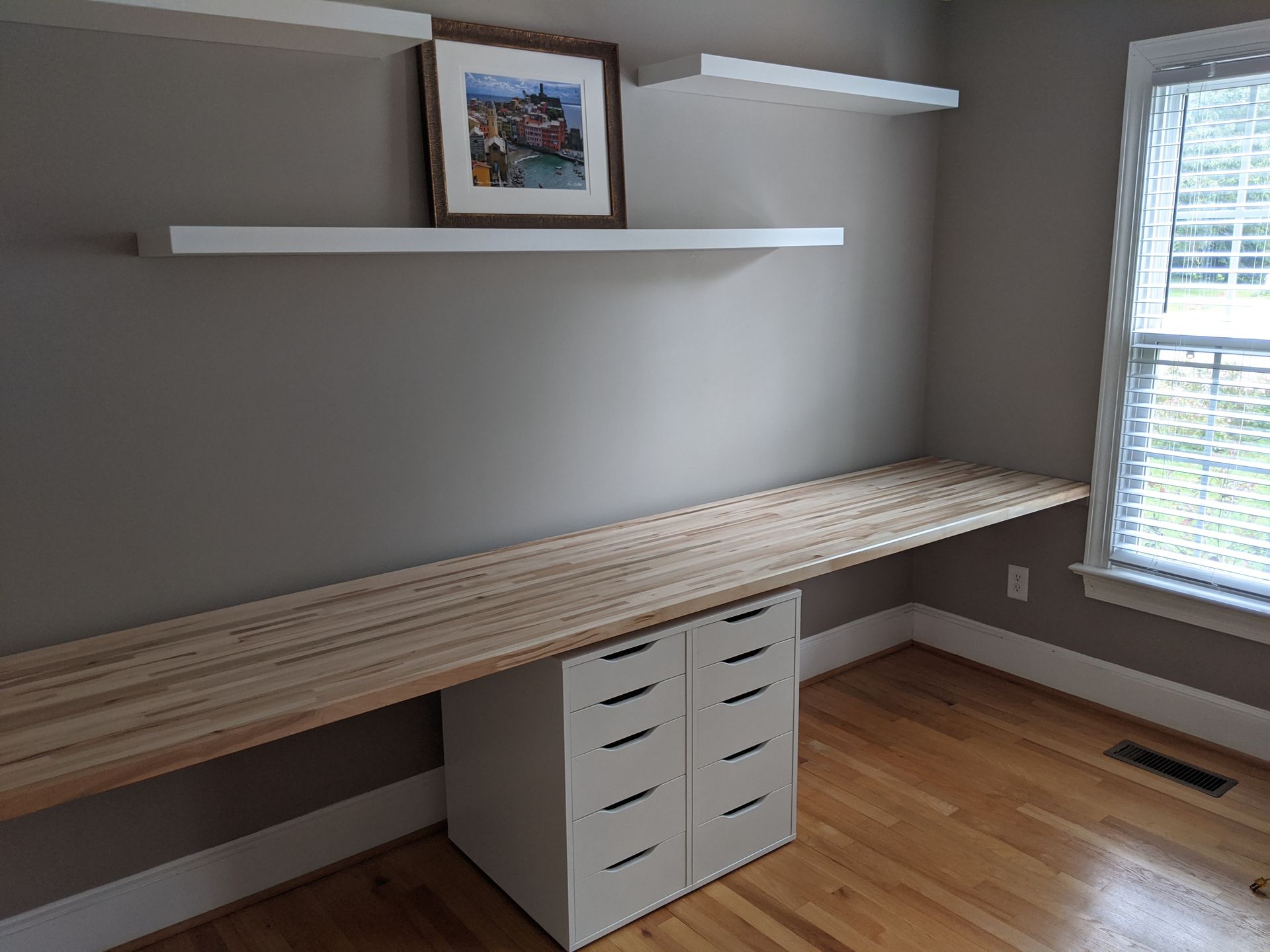 Angled view of the empty built-in desk installation
