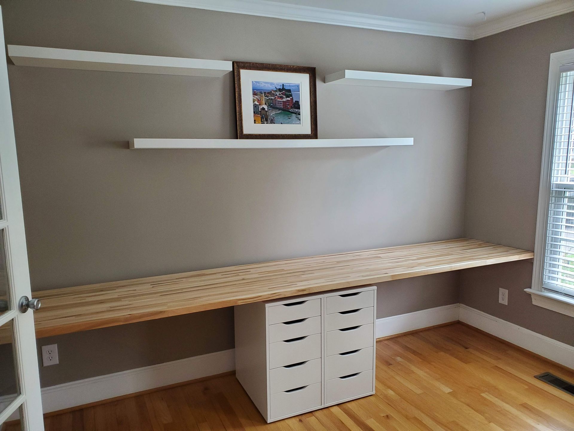 Front view of the empty built-in desk installation